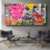 Farbenfrohes Wandbild von Banksy im Streetart Style und mit Neon Schrift Love is all we need