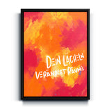 Buntes Spruch-Wandbild „Dein Lächeln verändert Räume“ auf Leinwand mit schwarzem Rahmen